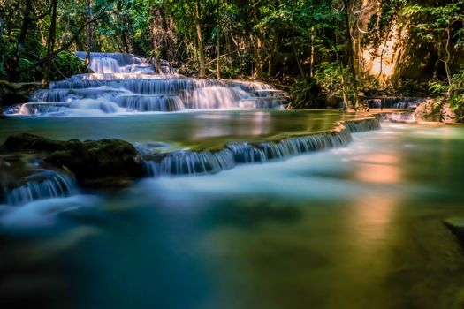 Long exposure exotic beautiful tropical deep rainforest waterfall Fresh turquoise waterfalls in deep forest of Huay Mae Khamin waterfall in the national park Beautiful landscape waterfalls.