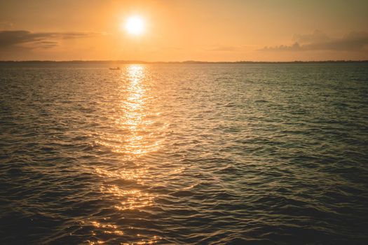 Sunset Sunrise Summer sea ocean Landscape. The sunlight reflect in sea surface beautiful Nature background.