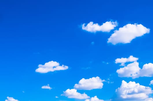white fluffys clouds arrange on blue sky background abstract weather season atmosphere.