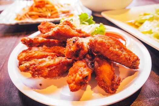 Fried wing chicken in white plate cuidine tasty delicious food.