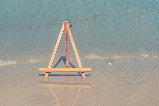 Wooden Easel photo stand tripod for photo with sea on background