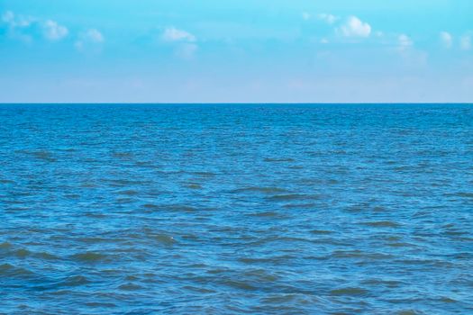 Blue Sea Ocean under blue sky with fluffy white cloud seascape nature background summer travel vacation