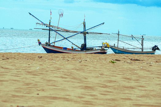 Old Wooden Boats  At The Beach  Andaman Sea, Thailand . Summer seascape with  beautiful beach warm sand .Summer wallpaper background