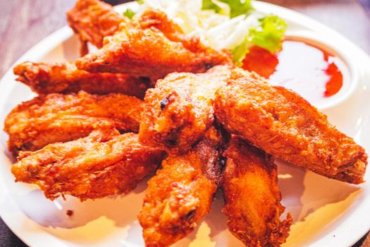 Fried wing chicken in white plate cuidine tasty delicious food.