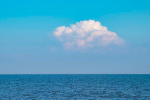 Blue Sea Ocean under blue sky with fluffy white cloud seascape nature background summer travel vacation
