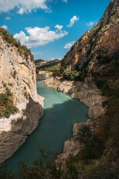 Aerial view of the Congost de Mont-rebei gorge and kayakers on sunny day in Catalonia, Spain.