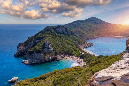 Porto Timoni is an amazing beautiful double beach in Corfu, Greece. Porto Timoni beach at Afionas is a paradise double beach with crystal clear azure water in Corfu, Ionian island, Greece, Europe
