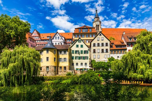 Beautiful floral colorful town Tubingen in Germany (Baden-Wurttemberg). Houses at river Neckar and Hoelderlin tower, Tuebingen, Baden-Wuerttemberg, Germany. Tubingen, Germany. 