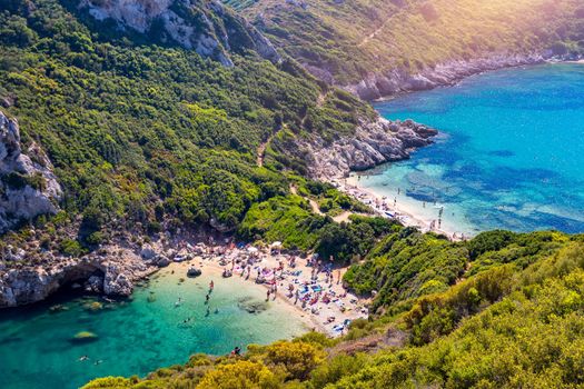 Porto Timoni is an amazing beautiful double beach in Corfu, Greece. Porto Timoni beach at Afionas is a paradise double beach with crystal clear azure water in Corfu, Ionian island, Greece, Europe