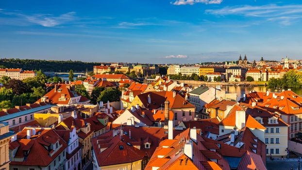 Charles Bridge in Prague in Czechia. Prague, Czech Republic. Charles Bridge (Karluv Most) and Old Town Tower. Vltava River and Charles Bridge. Concept of world travel, sightseeing and tourism.