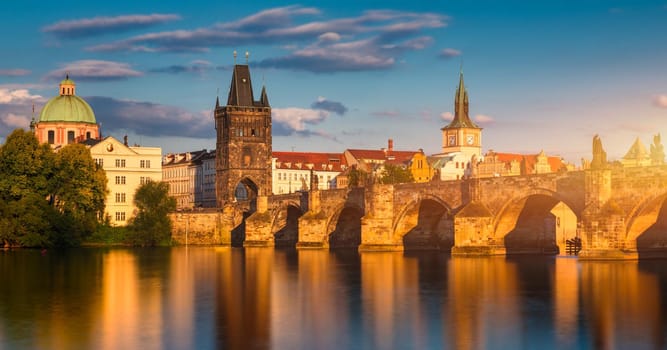Old town of Prague. Czech Republic over river Vltava with Charles Bridge on skyline. Prague panorama landscape view with red roofs.  Prague view from Petrin Hill, Prague, Czechia.