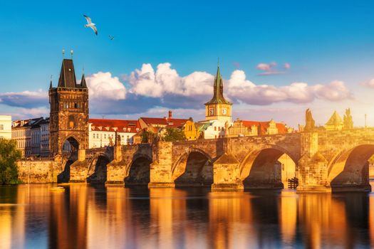 Charles Bridge in Prague in Czechia. Prague, Czech Republic. Charles Bridge (Karluv Most) and Old Town Tower. Vltava River and Charles Bridge. Concept of world travel, sightseeing and tourism.