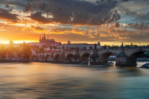 Charles Bridge in Prague in Czechia. Prague, Czech Republic. Charles Bridge (Karluv Most) and Old Town Tower. Vltava River and Charles Bridge. Concept of world travel, sightseeing and tourism.