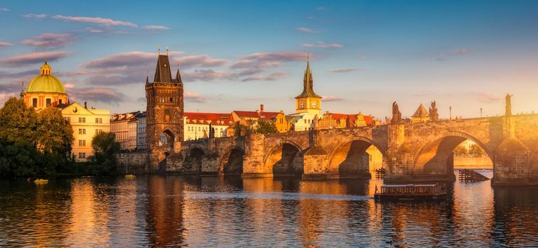 Old town of Prague. Czech Republic over river Vltava with Charles Bridge on skyline. Prague panorama landscape view with red roofs.  Prague view from Petrin Hill, Prague, Czechia.