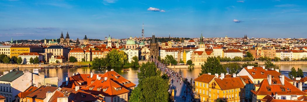 Old town of Prague. Czech Republic over river Vltava with Charles Bridge on skyline. Prague panorama landscape view with red roofs.  Prague view from Petrin Hill, Prague, Czechia.