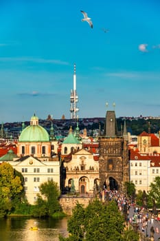 Old town of Prague. Czech Republic over river Vltava with Charles Bridge on skyline. Prague panorama landscape view with red roofs.  Prague view from Petrin Hill, Prague, Czechia.