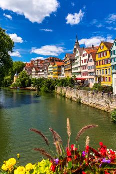 Beautiful floral colorful town Tubingen in Germany (Baden-Wurttemberg). Houses at river Neckar and Hoelderlin tower, Tuebingen, Baden-Wuerttemberg, Germany. Tubingen, Germany. 