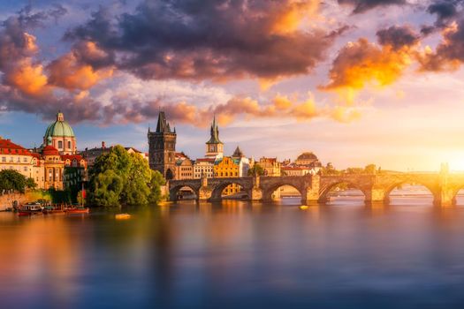 Charles Bridge in Prague in Czechia. Prague, Czech Republic. Charles Bridge (Karluv Most) and Old Town Tower. Vltava River and Charles Bridge. Concept of world travel, sightseeing and tourism.