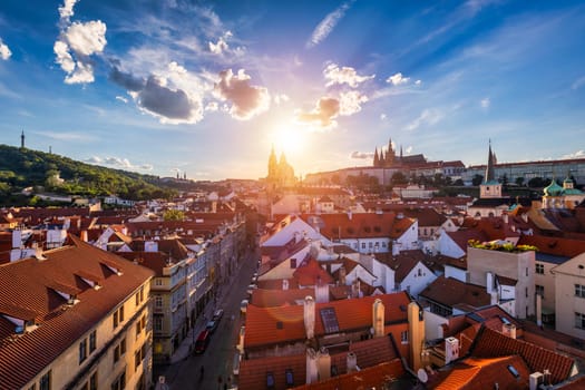 Old town of Prague. Czech Republic over river Vltava with Charles Bridge on skyline. Prague panorama landscape view with red roofs.  Prague view from Petrin Hill, Prague, Czechia.