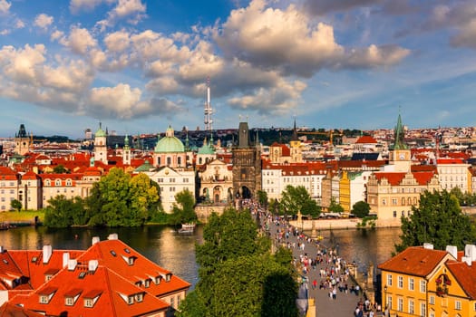 Old town of Prague. Czech Republic over river Vltava with Charles Bridge on skyline. Prague panorama landscape view with red roofs.  Prague view from Petrin Hill, Prague, Czechia.