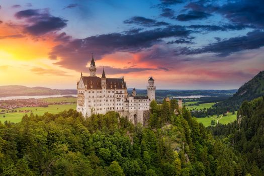 Famous Neuschwanstein Castle with scenic mountain landscape near Fussen, Bavaria, Germany. Neuschwanstein Castle in Hohenschwangau, Germany. 