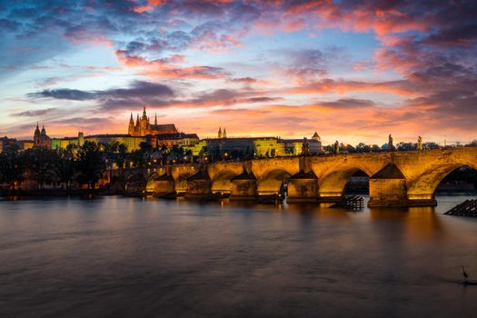 Charles Bridge in Prague in Czechia. Prague, Czech Republic. Charles Bridge (Karluv Most) and Old Town Tower. Vltava River and Charles Bridge. Concept of world travel, sightseeing and tourism.