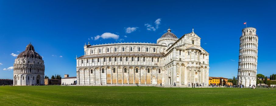 Pisa Cathedral and the Leaning Tower in a sunny day in Pisa, Italy. Pisa Cathedral with Leaning Tower of Pisa on Piazza dei Miracoli in Pisa, Tuscany, Italy.