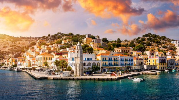 View of the beautiful greek island of Symi (Simi) with colourful houses and small boats. Greece, Symi island, view of the town of Symi (near Rhodes), Dodecanese.