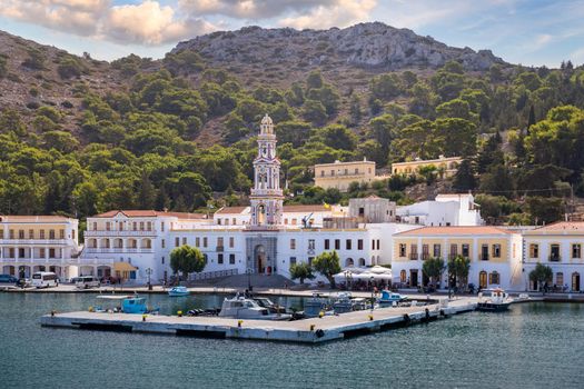 Sacred Monastery of Saint Archangel Michael the Panormitis, Symi, Greece. Monastery of Saint Archangel Michael, sacred place on coast of sea Aegean Symi island in Greece overlooking Panormitis port.