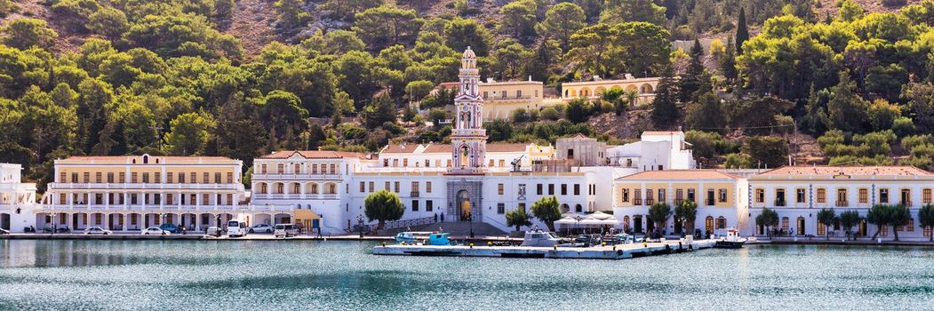 Sacred Monastery of Saint Archangel Michael the Panormitis, Symi, Greece. Monastery of Saint Archangel Michael, sacred place on coast of sea Aegean Symi island in Greece overlooking Panormitis port.