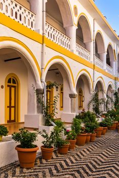 Sacred Monastery of Saint Archangel Michael the Panormitis, Symi, Greece. Monastery of Saint Archangel Michael, sacred place on coast of sea Aegean Symi island in Greece overlooking Panormitis port.