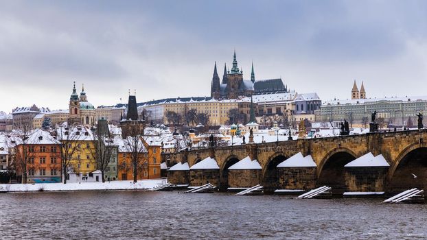 Famous historic Charles bridge in winter, Old Town bridge tower, Prague, Czech republic. Prague castle and Charles bridge, Prague (UNESCO), Czech republic.