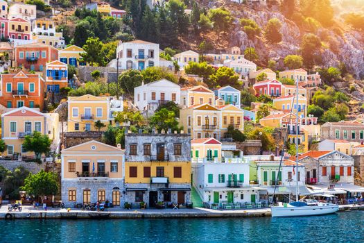 View of the beautiful greek island of Symi (Simi) with colourful houses and small boats. Greece, Symi island, view of the town of Symi (near Rhodes), Dodecanese.