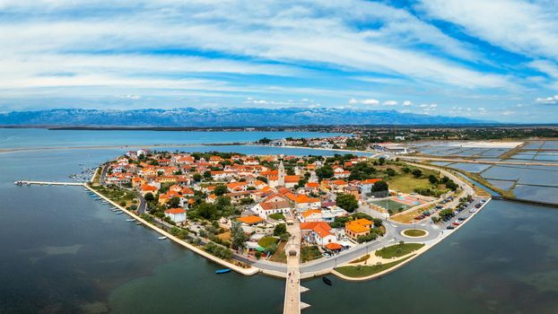 Historic town of Nin laguna aerial view with Velebit mountain background, Dalmatia region of Croatia. Aerial view of the famous Nin lagoon and medieval in Croatia