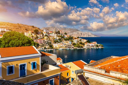 View of the beautiful greek island of Symi (Simi) with colourful houses and small boats. Greece, Symi island, view of the town of Symi (near Rhodes), Dodecanese.