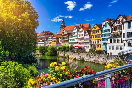 Beautiful floral colorful town Tubingen in Germany (Baden-Wurttemberg). Houses at river Neckar and Hoelderlin tower, Tuebingen, Baden-Wuerttemberg, Germany. Tubingen, Germany. 