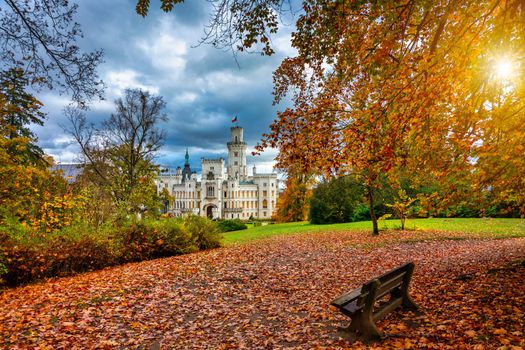 Castle Hluboka nad Vltavou is one of the most beautiful castles in Czech Republic. Castle Hluboka nad Vltavou in autumn with red foliage, Czechia. Colorful autumn view of Hluboka nad Vltavou castle.