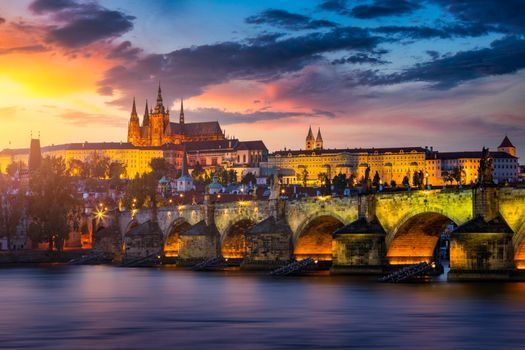 Charles Bridge sunset view of the Old Town pier architecture, Charles Bridge over Vltava river in Prague, Czechia. Old Town of Prague with Charles Bridge and Castle in the background, Czech Republic.