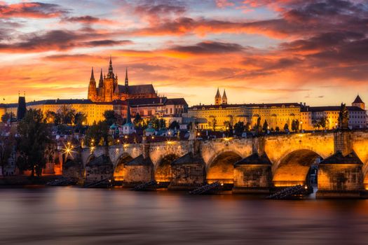 Charles Bridge sunset view of the Old Town pier architecture, Charles Bridge over Vltava river in Prague, Czechia. Old Town of Prague with Charles Bridge and Castle in the background, Czech Republic.