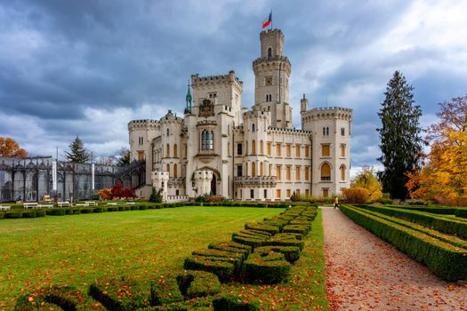 Castle Hluboka nad Vltavou is one of the most beautiful castles in Czech Republic. Castle Hluboka nad Vltavou in autumn with red foliage, Czechia. Colorful autumn view of Hluboka nad Vltavou castle.