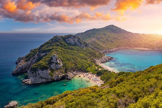 Porto Timoni is an amazing beautiful double beach in Corfu, Greece. Porto Timoni beach at Afionas is a paradise double beach with crystal clear azure water in Corfu, Ionian island, Greece, Europe