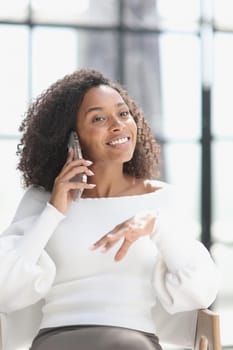 Portrait of a young African American woman using a smartphone