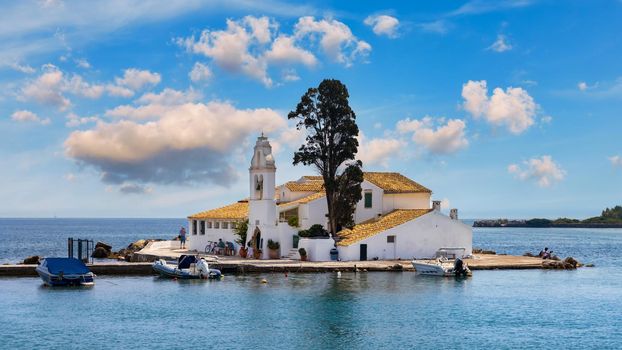 Beautiful landscape with Holy Monastery of Panagia Vlacherna of the coast Ionian Sea in the Corfu or Kerkyra is a Greek island, Europe. Monastery of Panagia Vlacherna in Corfu island, Ionian, Greece
