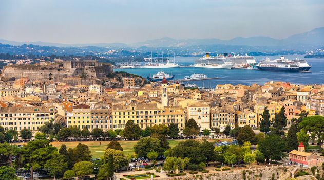 Panoramic view of Kerkyra, capital of Corfu island, Greece. View of Kerkyra with beautiful buildings during summer sunny day. Corfu island, Greece. 