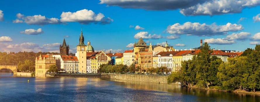 Old Town of Prague in Czechia. Prague, Czech Republic. Vltava River and old buildings across the river. Concept of world travel, sightseeing and tourism.