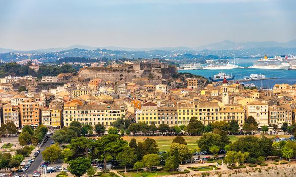 Panoramic view of Kerkyra, capital of Corfu island, Greece. View of Kerkyra with beautiful buildings during summer sunny day. Corfu island, Greece. 