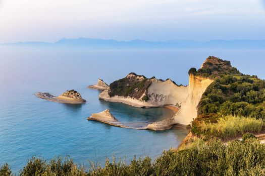 Beautiful view of Cape Drastis in the island of Corfu in Greece. Cape Drastis, the impressive formations of the ground, rocks and the blue waters panorama, Cape Drastis, Corfu, Greece, Ionian Islands.
