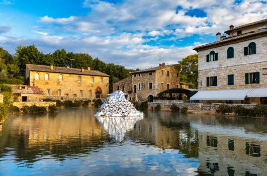 Thermal bath town of Bagno Vignoni, Italy during sunrise. Old thermal baths in the medieval village Bagno Vignoni, Tuscany, Italy. Medieval thermal baths in village Bagno Vignoni, Tuscany, Italy 