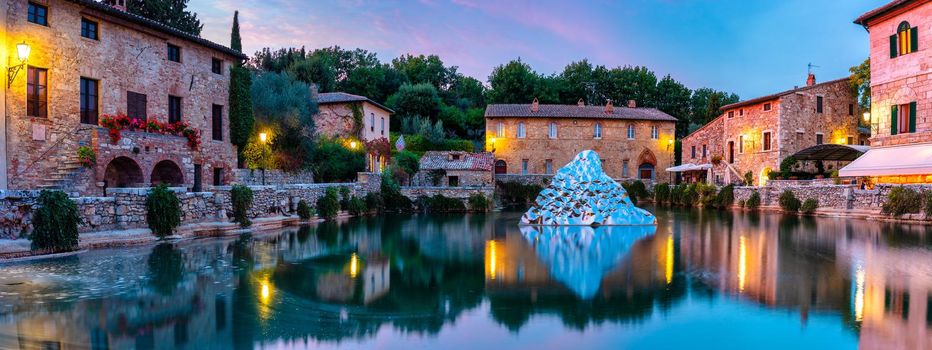 Thermal bath town of Bagno Vignoni, Italy during sunrise. Old thermal baths in the medieval village Bagno Vignoni, Tuscany, Italy. Medieval thermal baths in village Bagno Vignoni, Tuscany, Italy 