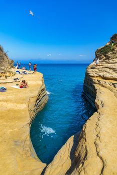 Famous Canal D'amour in Sidari, Corfu island, Greece. Famous Canal d'Amour beach with beautiful rocky coastline in amazing blue Ionian Sea in Sidari holiday village on Corfu island in Greece.
Panoramic view of Kerkyra, capital of Corfu island, Greece. Aerial drone view of Kerkyra with beautiful buildings during summer sunny day. Corfu island, Greece. 